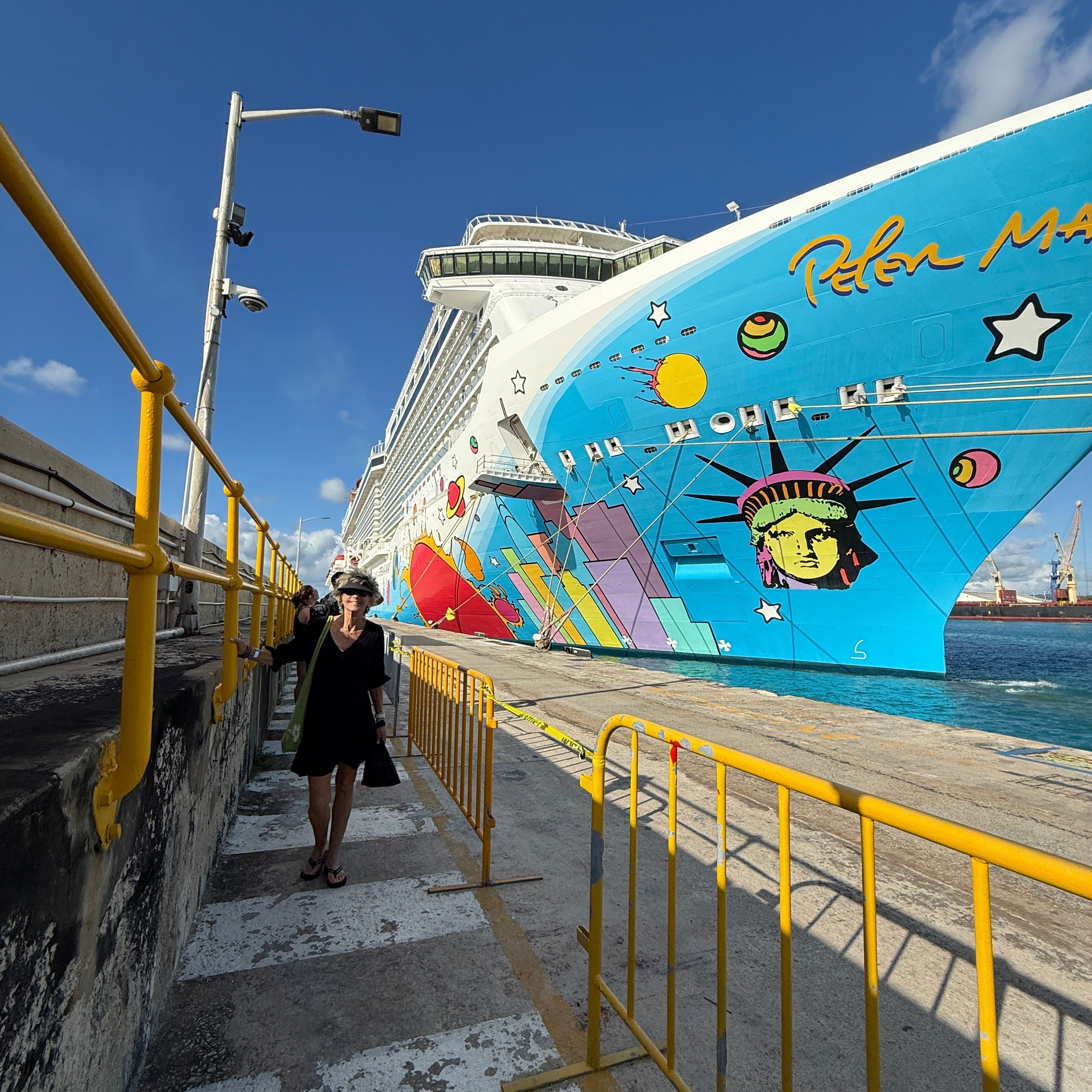 Cruise ship with lady walking by