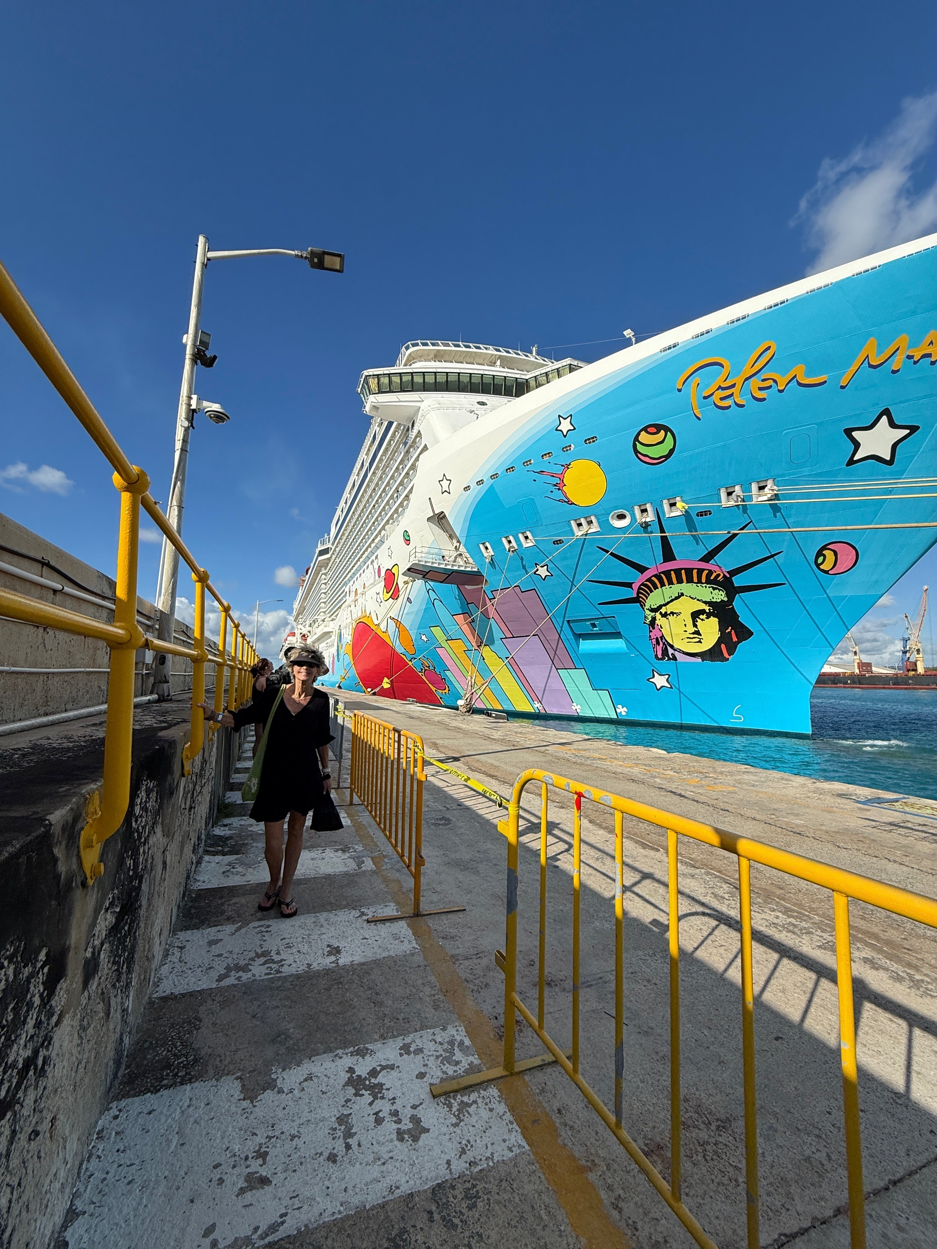 Cruise ship with lady walking by